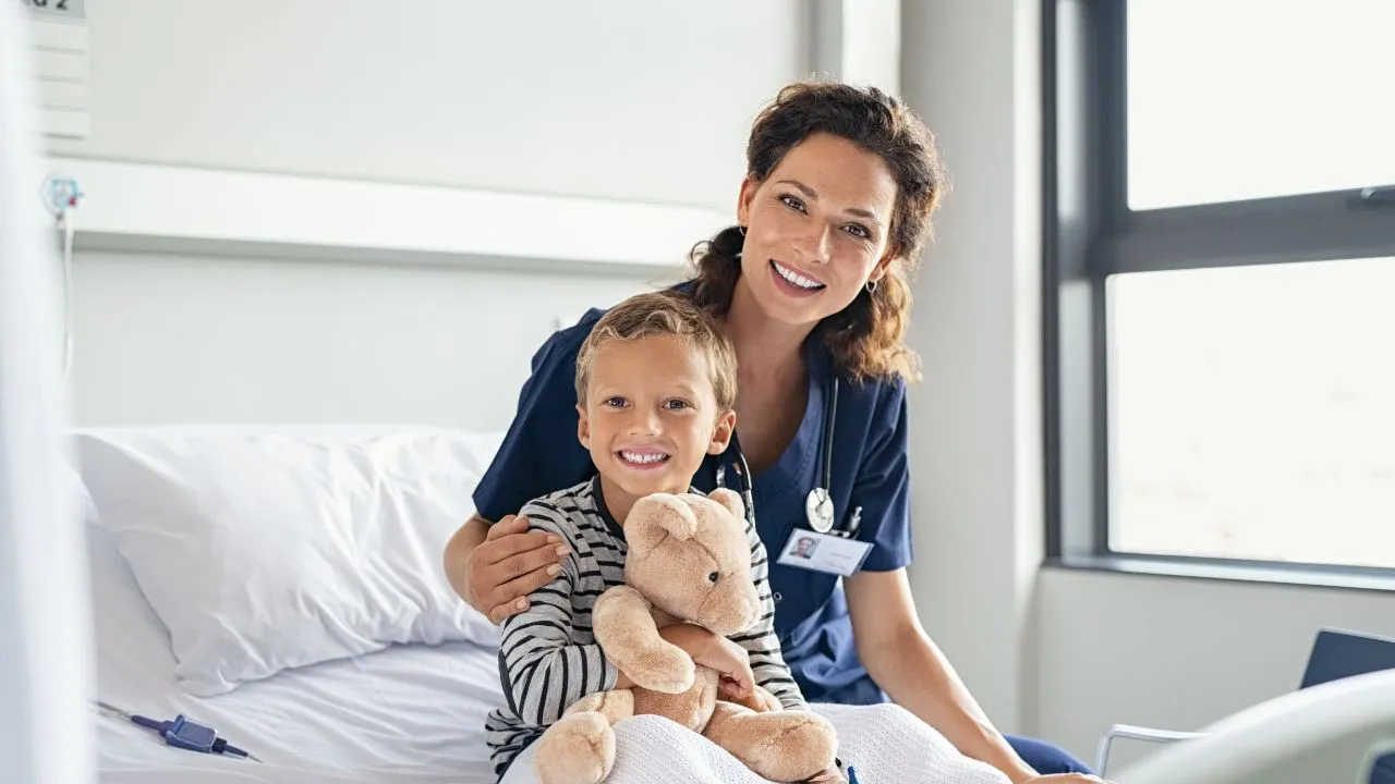 PICU nurse with patient
